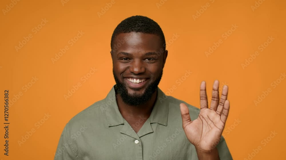 Poster Senior man enthusiastically waving and saying hello. His joyful expressions convey a sense of positivity and connection.