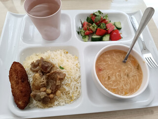 Food served to factory workers during lunch break
