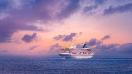 Majestic cruise ship at sunset on calm ocean waters