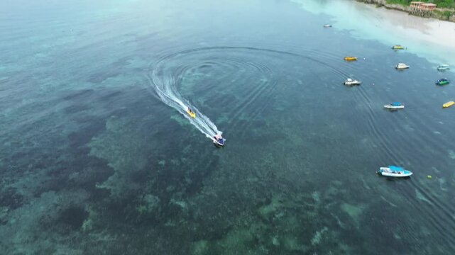 Bulukumba, Indonesia, 16 February 2025 : Scenic Aerial View Of Turquoise Ocean Waters Near Coastline With Watercraft