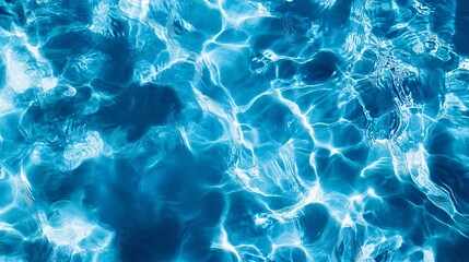 Clear Blue Water Surface with Sunlight Reflections and Patterns