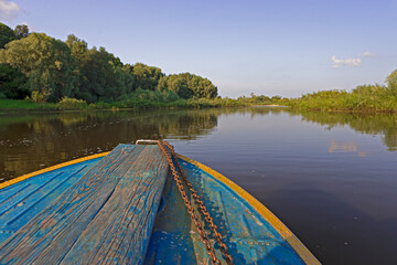 Travel ideas. Closeup of Boat Fore Traveling Through the River with Water splashes From Starboard...