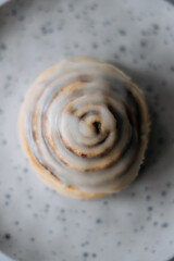 Homemade cinnabon on a plate close up