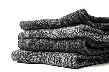 Top view of grey woolen winter socks on white background