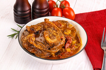Italian cuisine - ossobuco with sauce