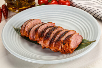 Sliced duck breast baked with cherry