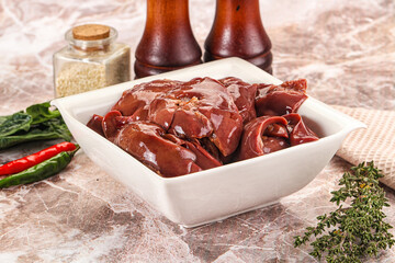 Raw uncokked chicken liver in the bowl