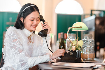 Elegant woman engaging in vintage telephone call at chic urban setting lifestyle photography