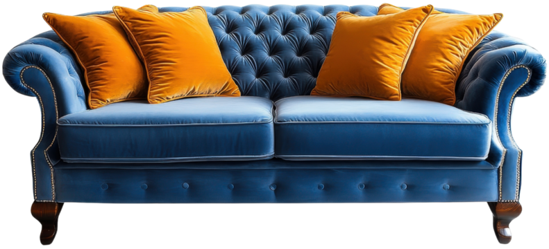 Blue velvet sofa with orange cushions, isolated.