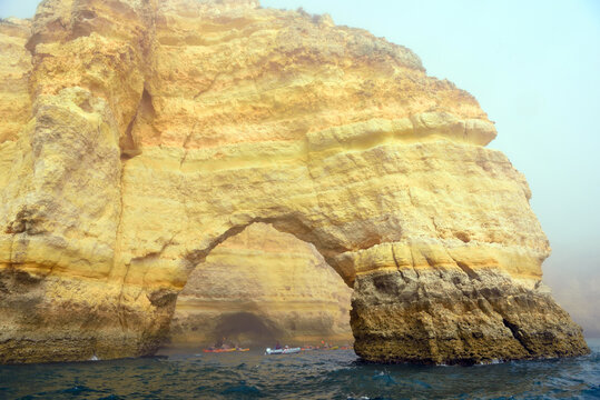 foggy landscape, the Algarve rock formation  is a unique and amazing natural wonder located in the coastal town of Porches, Portugal
