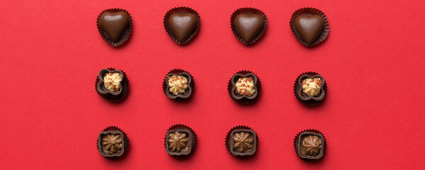 Different kinds of chocolates on colored table close-up. Top View and Flat Lay