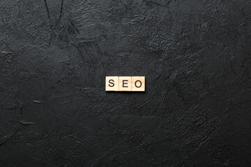 seo word written on wood block. Search Engine Optimization text on table, concept