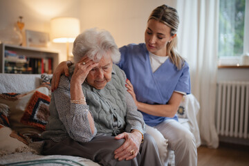 Nurse hugging elderly patient, mental health support and grief counseling to senior woman.