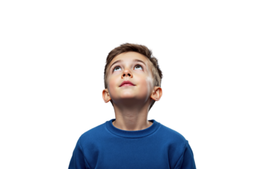 Young boy wearing a blue sweater looking up with a curious expression, isolated on a white background. Concept of curiosity and imagination. Ai generative
