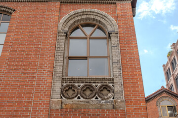 A collection of various exterior windows on buildings, showcasing diverse architectural styles and materials.