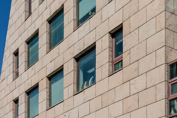 A collection of various exterior windows on buildings, showcasing diverse architectural styles and materials.