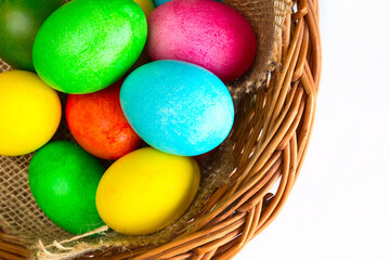 Colored decorated Easter eggs in basket