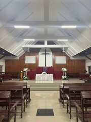 Spacious Church Interior with Wooden Pews and Altar