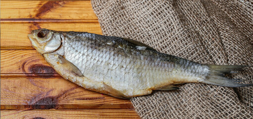 Close-up shot of dried roach or ram fish, with scale details and fish structure