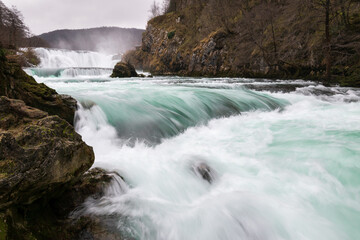 Waterfall and cascade on Una river, water sprays and flows in motion blur, turquoise colour