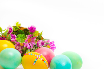 Easter eggs and flower bouquet on white background