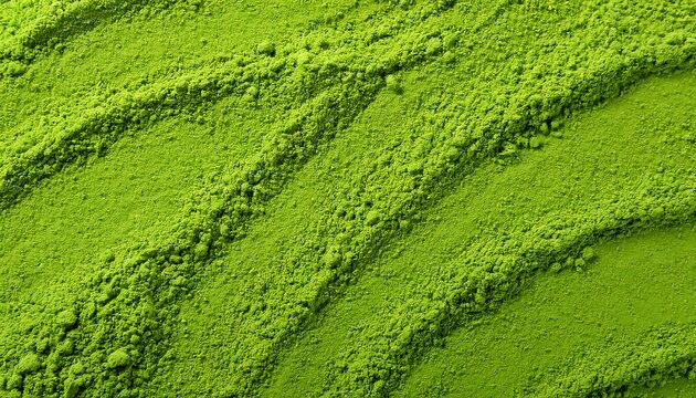 Close-up of vibrant green matcha powder, highlighting its fine, velvety texture and bright color. Ideal for Japanese tea culture, health-focused concepts, or modern aesthetics. Texture, background.