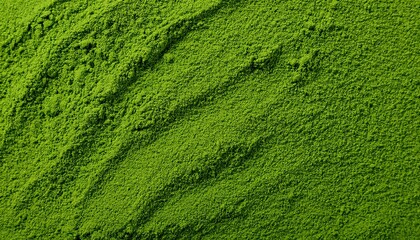 Close-up of vibrant green matcha powder, highlighting its fine, velvety texture and bright color. Ideal for Japanese tea culture, health-focused concepts, or modern aesthetics. Texture, background.