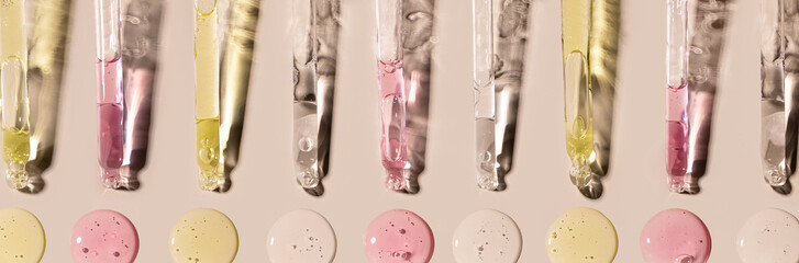 banner samples serum tests glass pipettes with drops of serum on a light beige background