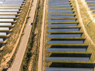 Aerial view of a solar farm in Teruel, Spain, with rows of photovoltaic panels generating renewable energy. Sustainable infrastructure for green power.