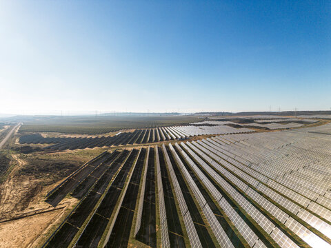 Expansive solar panel field in Teruel, Spain, capturing sunlight for clean energy production. Large-scale renewable energy source in a natural landscape.