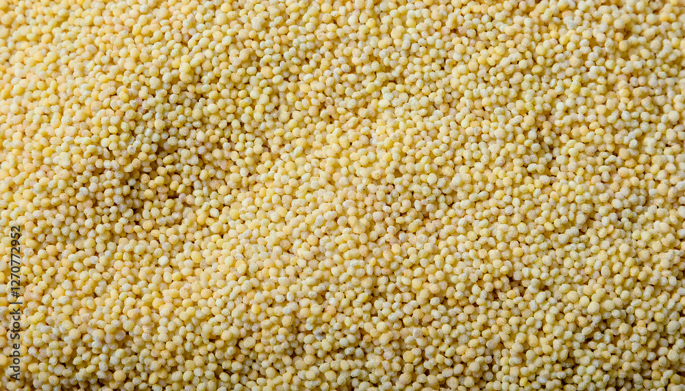Fototapete Repeating pattern of tiny couscous grains, emphasizing their uniform size and golden color. Ideal for Mediterranean cuisine or healthy food concepts. Texture, background.