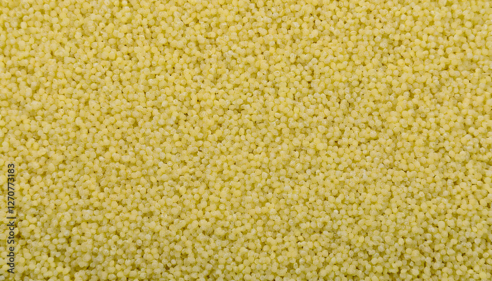 Fototapete repeating pattern of tiny couscous grains, emphasizing their uniform size and golden color. ideal fo