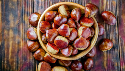 Obraz premium Background featuring chestnuts texture, showcasing their rough surface and warm brown tones. Ideal for autumn, baking, or natural food concepts. Texture, background.