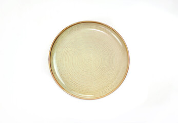 Empty ceramic round beige plate isolated on white background. Top view
