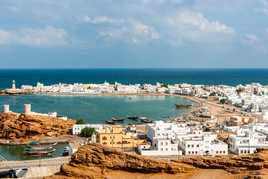 Scenic view of Sur harbor with traditional dhows in Oman