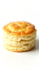 Flaky biscuit stacked in layers with golden crust in closeup view