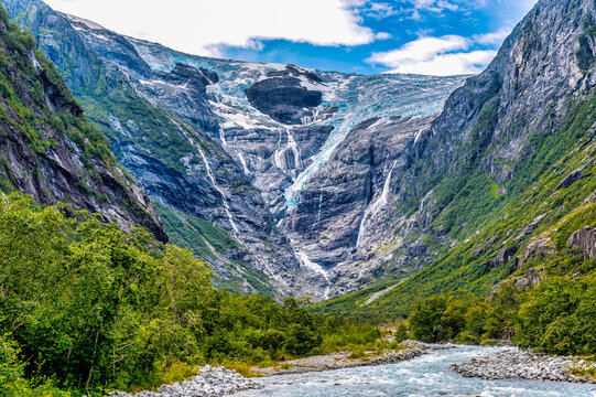 Kjenndal Glacier in the Nordfjord region of Norway with a scenic view of mountains and a river