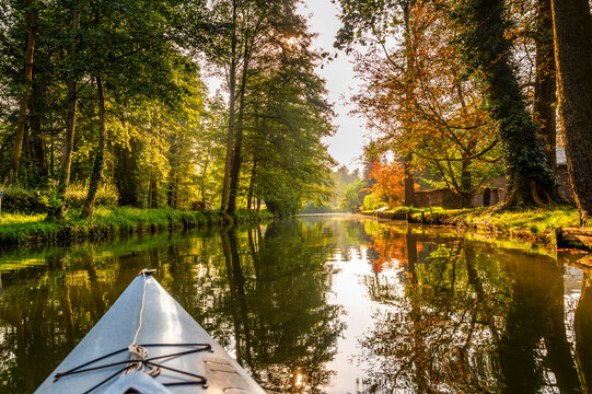 Paddle boat tour on the river Spree in autumn, Spreewald, Germany