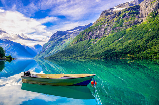 Rowing boat on Lovanet lake with Kjenndal glacier in Norway's Nordfjord region