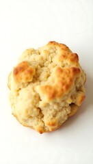 Fototapeta premium Closeup of a freshly baked biscuit on a clean surface revealing texture and color
