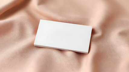 Obraz premium A premium business card mockup with gold foil embossing, placed on luxurious textured fabric. Soft lighting enhances the high-end branding, perfect for corporate identity presentations