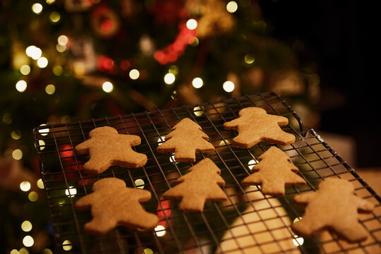 Gingerbread man and Christmas tree cookies on cooling rack
