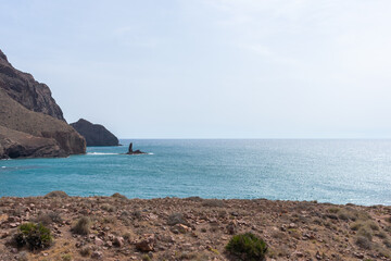 black volcanic cliffs on the Mediterranean coast