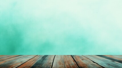 Fototapeta premium A serene wooden tabletop against a soft turquoise background, perfect for product display and photography