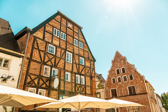 Redbrick gothic building and half-timbered historic house in Wismar's old town, Germany