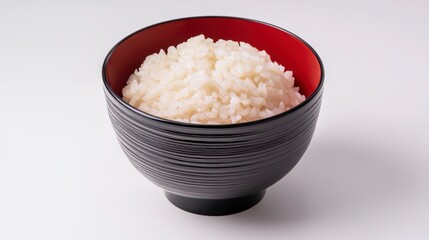 Minimalist Style Bowl of Cooked Rice Displayed in a Black Bowl on White Background