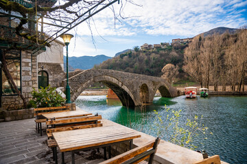 Arched bridge over Crnojevic river in small town near Skadar lake in Montenegro in winter time