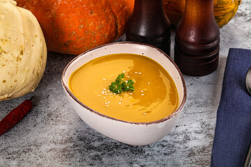 Vegan pumpkin cream soup served sesam