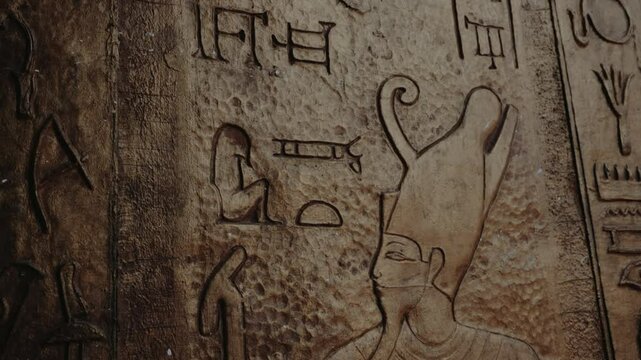 Ancient Egyptian Pharaoh Carving in Marrakech, Morocco. Close-up of hieroglyphs on a textured wall, showing historical art and cultural heritage. mystique of ancient Egypt in this historical footage.