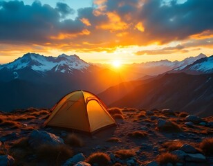 tourist tent camping in mountains at sunset